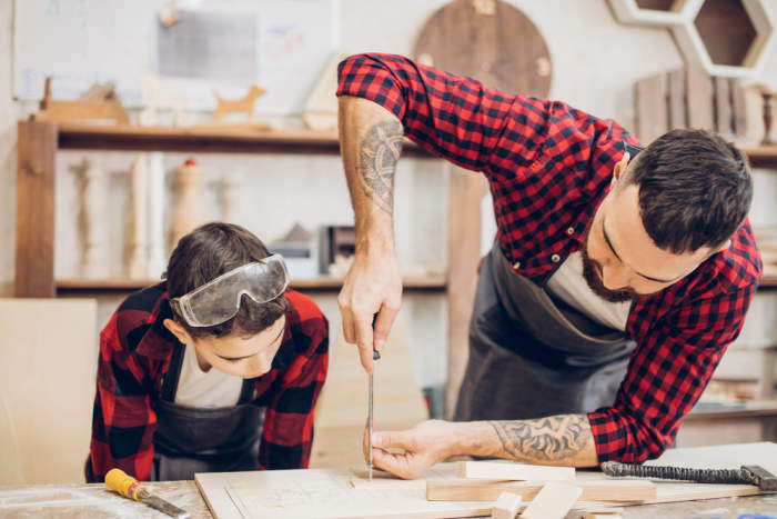 Dad and Son making a wooden bench