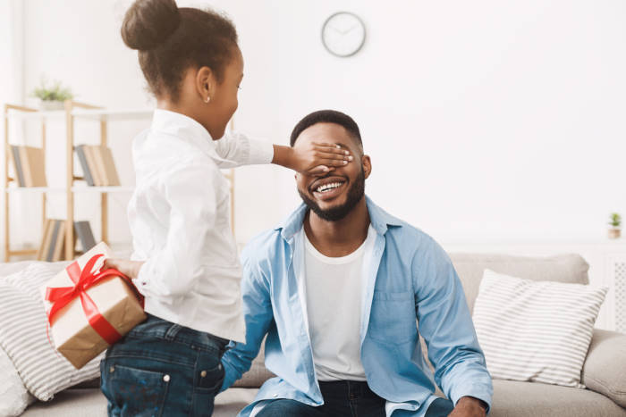 Present For Father. Child Girl Closing His Eyes And fathers day Gift