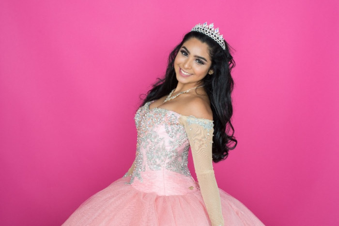 Teen girl in quinceanera dress and crown